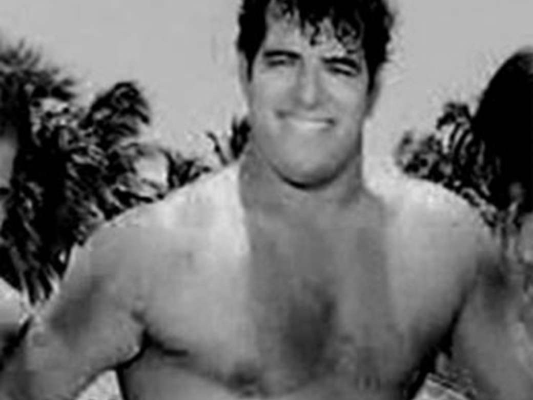 Dara Singh smiling on a beach